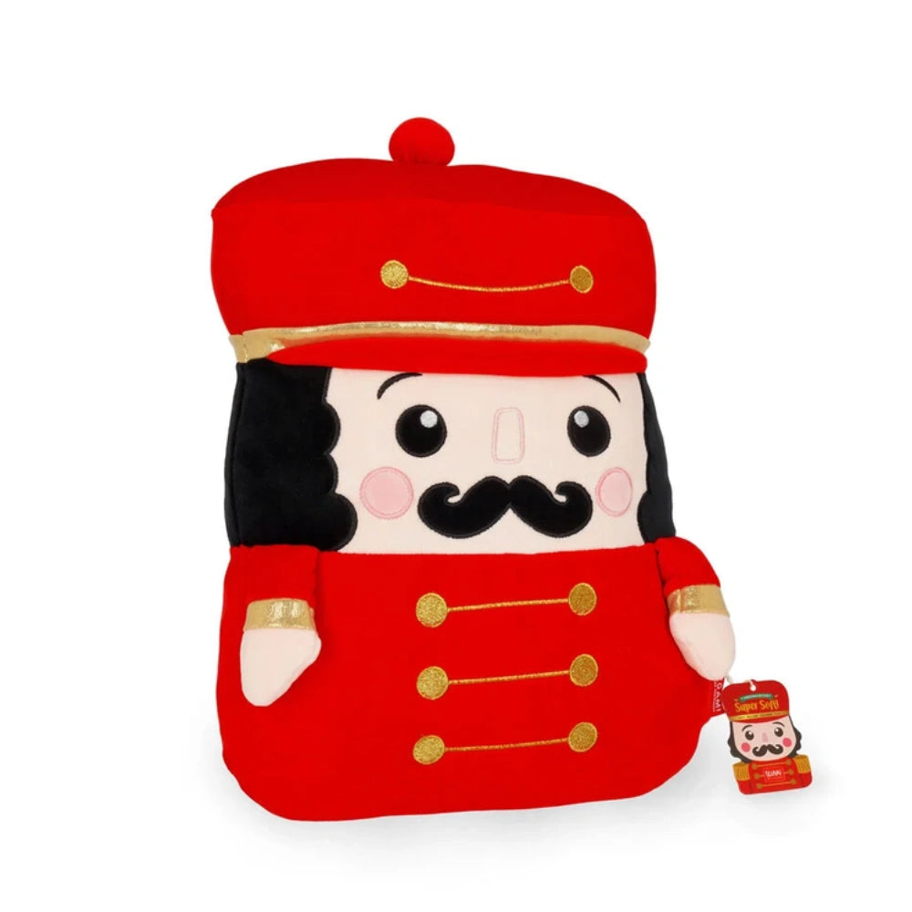 Cuscino Legami Nutcracker Super Soft rosso a forma di schiaccianoci, con cartellino e dettagli dorati
